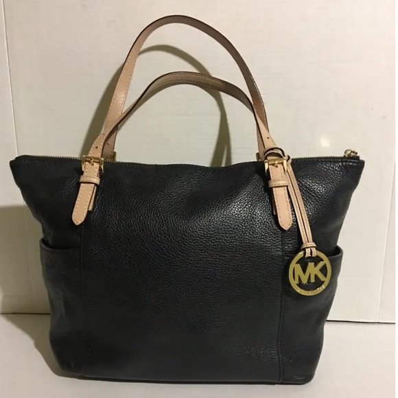 Michael Kors Handbags - Michael Kors
LEATHER TOTE . Used in great condition. One of the kind